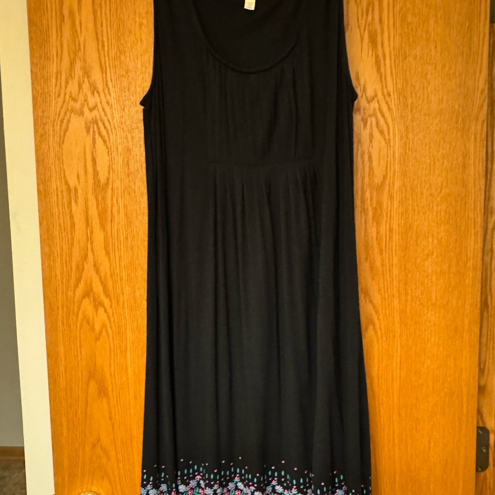 Elegant Black Sleeveless Dress with Colorful Hem